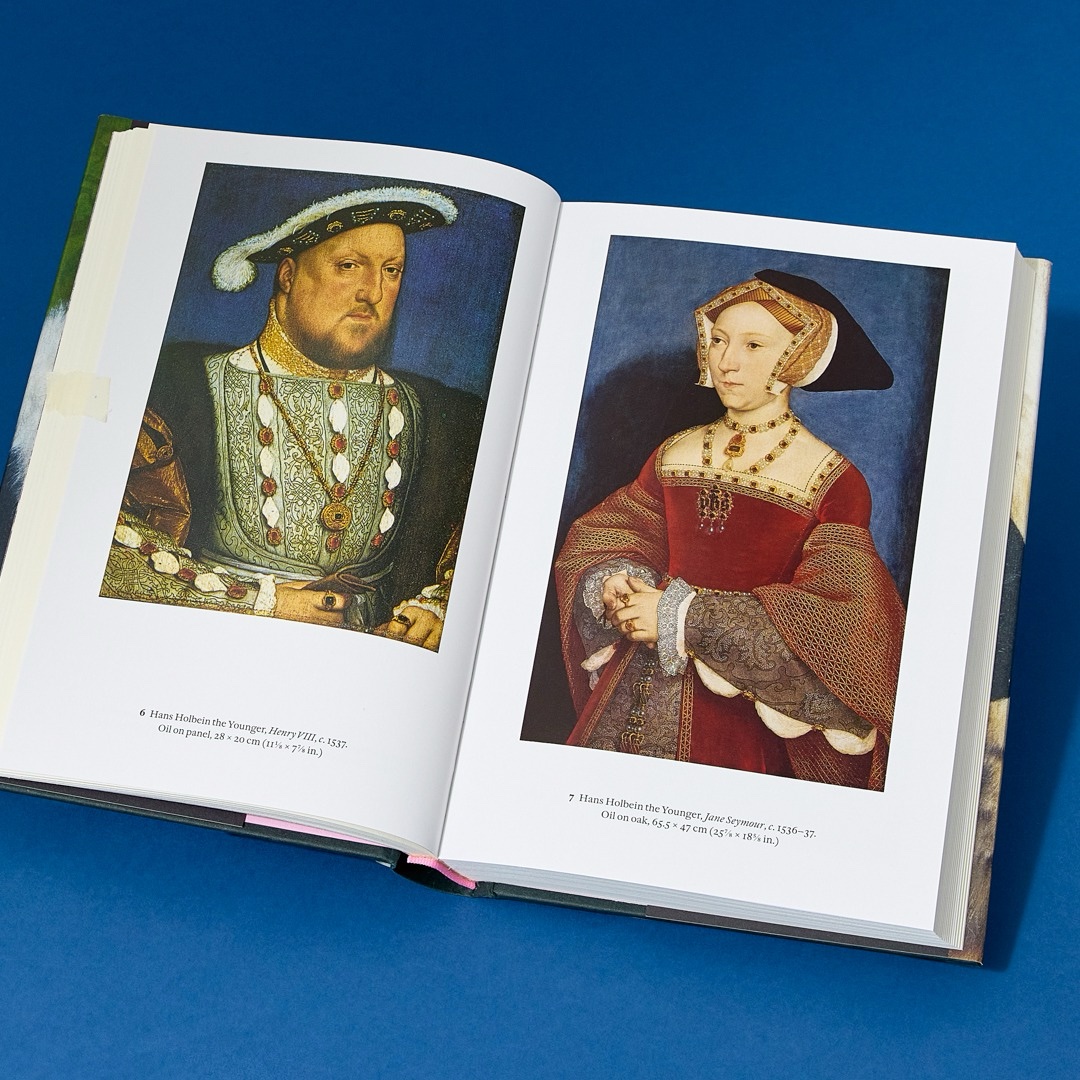 The book open at Hans Holbein the Younger's portraits of Henry VIII and Jane Seymour.