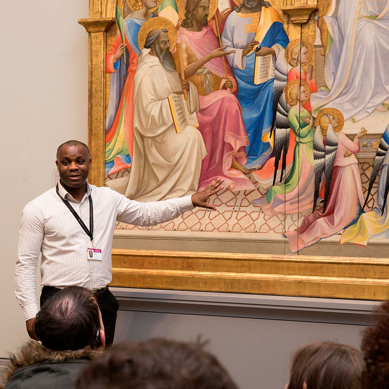 Leslie Primo with Lorenzo Monaco's painting The Coronation of the Virgin.